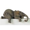 A Dozing Baby Shelf Sitter Elephant Figurine